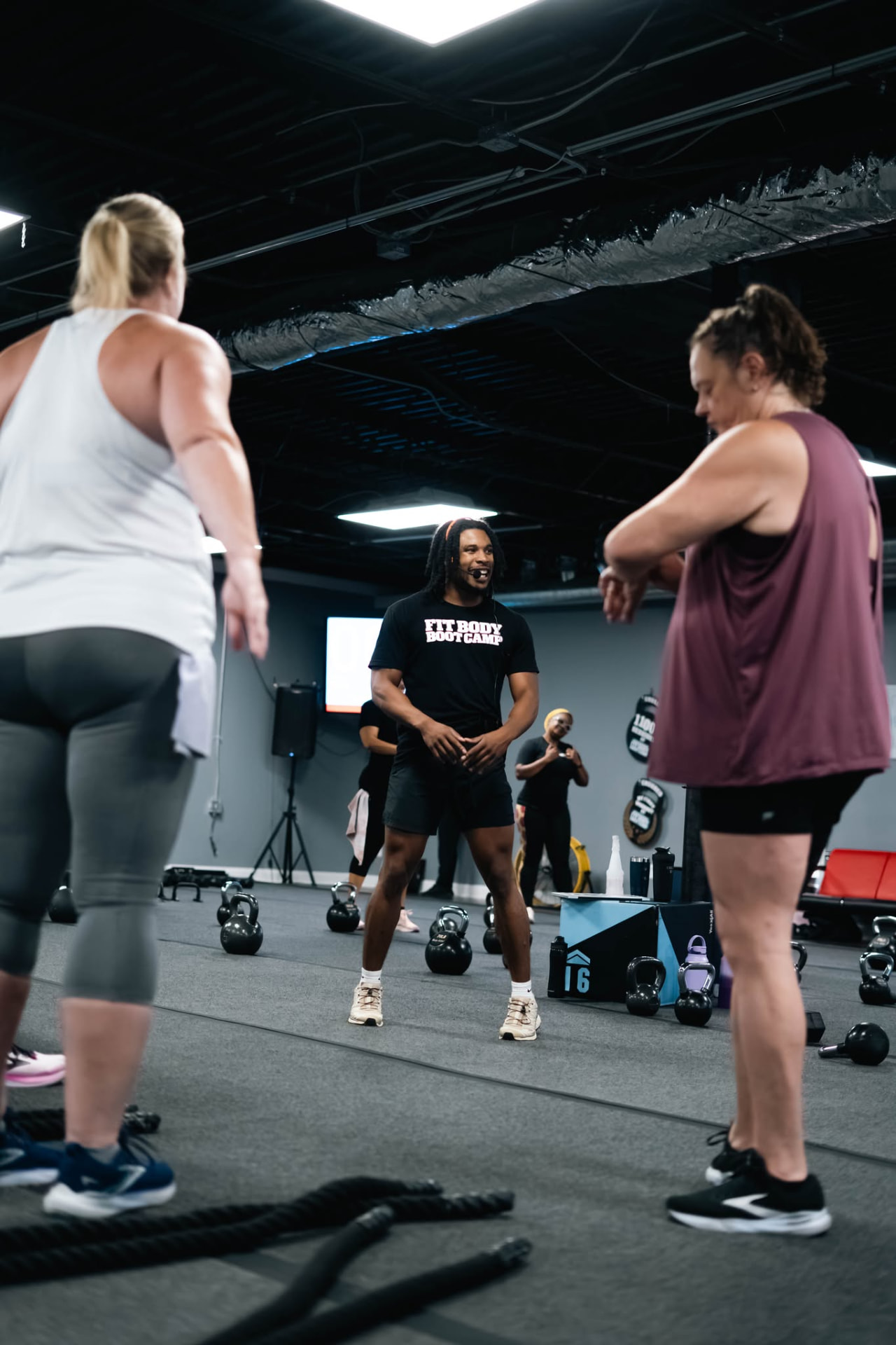 Coach leading a kettlebell group workout